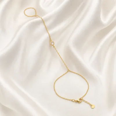 pulseira de mão dourada minimalista com cristal em cetim marfim, referência 85473-1