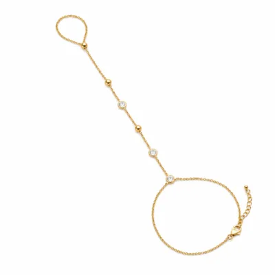 pulseira de mão dourada com cristais e contas em fundo branco, referência 85474-2