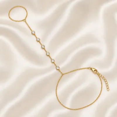 pulseira de mão dourada com seis cristais em cetim marfim, referência 85474-3