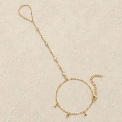 pulseira de mão dourada com quatro cristais e contas em pedra clara de tom quente, referência 85475-1