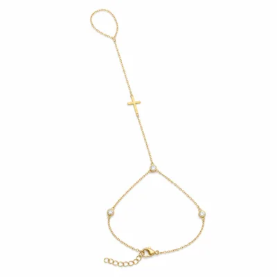pulseira de mão dourada com cruz e três cristais em fundo branco, referência 85475-2
