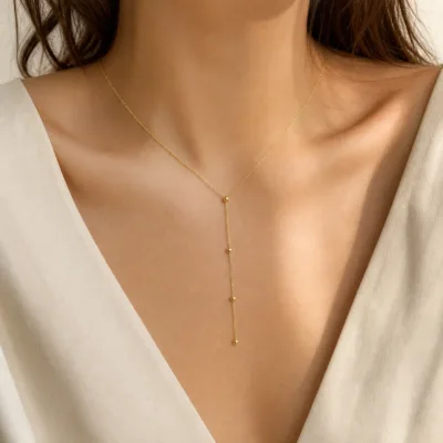 colar dourado em Y com círculos, cetim marfim, referência 85477-3