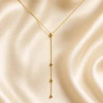 colar dourado em Y com círculos, pedra clara de tom quente, referência 85477-3