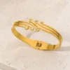 bracelete dourado triplo com cristais, imagem 1, referência 85579-3