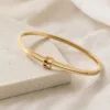 Pulseira Rígida de Linhas Paralelas — 2 Cores — A — Dourado