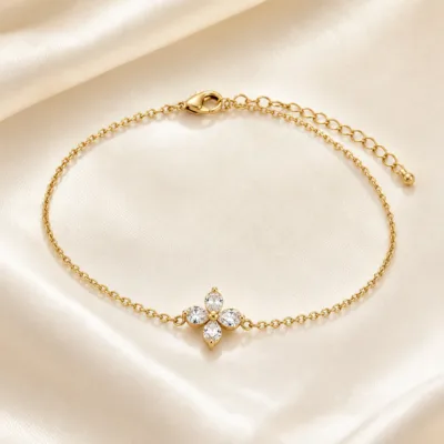 pulseira dourada com flor de cristais, cetim marfim, referência 85588-4