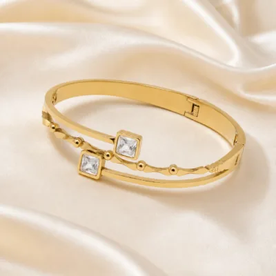 pulseira com dois cristais quadrados, variante dourada, cetim marfim, referência 85594-1