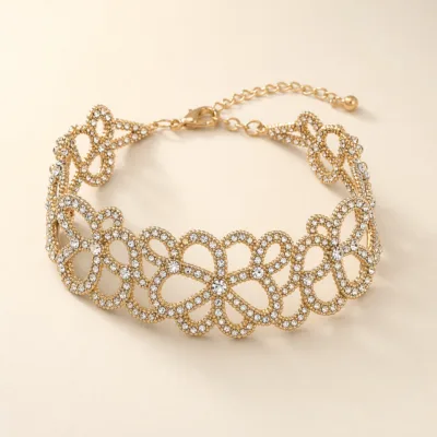 Pulseira Larga Dourada com Laços Entrelaçados — A — Dourado