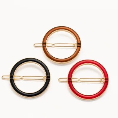Ganchos de cabelo circulares em preto, castanho e vermelho