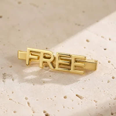 Gancho de cabelo metálico FREE em acabamento dourado