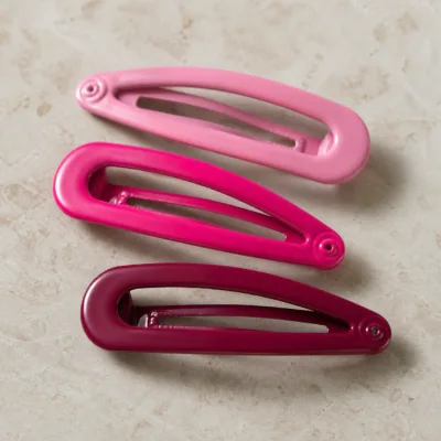 Detalhe dos ganchos BB em três tons rosa