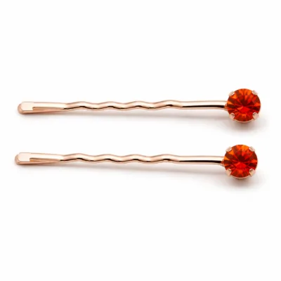 Conjunto de dois ganchos rosa-dourado com cristal laranja