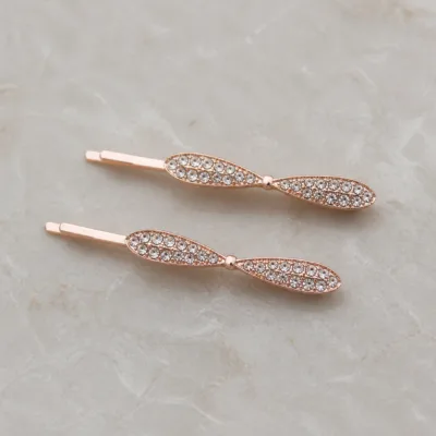 Ganchos rosa-dourado com laços finos e strass transparente