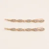 Conjunto de dois ganchos rosa-dourado com folhas e strass