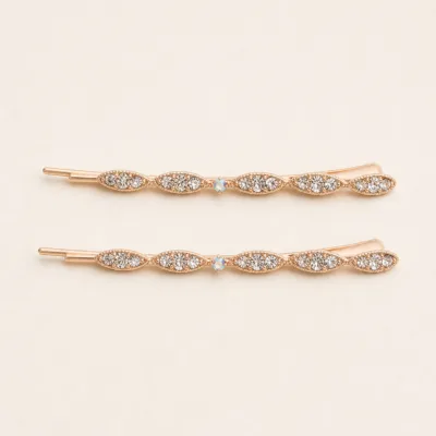 Conjunto de dois ganchos rosa-dourado com folhas e strass