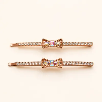 Conjunto de dois ganchos rosa-dourado com laço multicolor