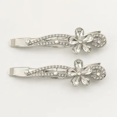 Conjunto de dois ganchos prateados com flor e folhas de cristais