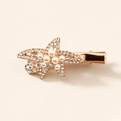Gancho bico de pato rosa-dourado com pérolas e strass