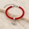 Pulseira vermelha com elefante prateado de cristais