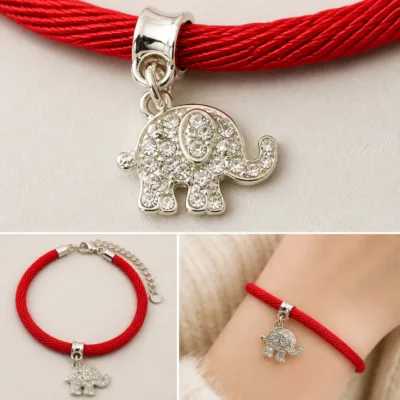 Detalhe do elefante prateado com cristais e tromba levantada