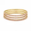 Conjunto de quatro pulseiras douradas com cristais rosa suave