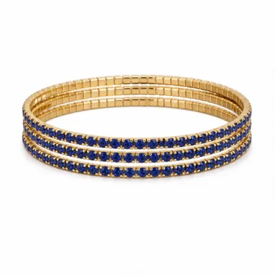 Conjunto de quatro pulseiras douradas com cristais azul-escuro
