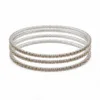 Conjunto de quatro pulseiras prateadas com cristais champanhe