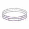 Conjunto de quatro pulseiras prateadas com cristais lilás-claro