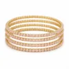 Conjunto de quatro pulseiras douradas com cristais rosa-claro