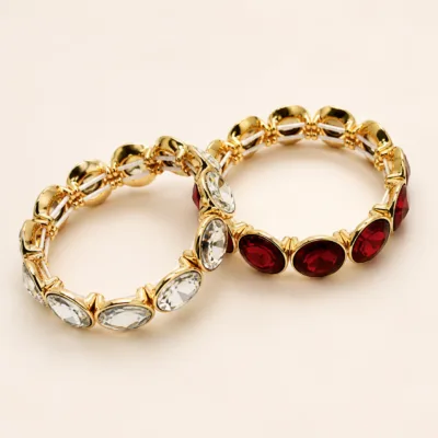Pulseiras douradas de vidro oval transparente e vermelho