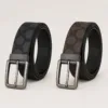 Cintos preto e castanho com padrão circular