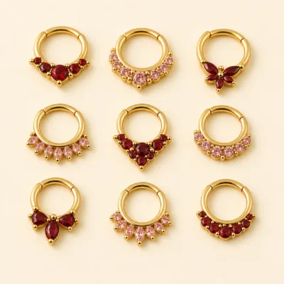 Piercing de Septo Dourado com Zircónias Vermelhas e Rosa — Dourado com zircónias vermelhas e rosa