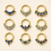 Piercing de Septo Dourado com Zircónias Azuis — Dourado com zircónias azuis
