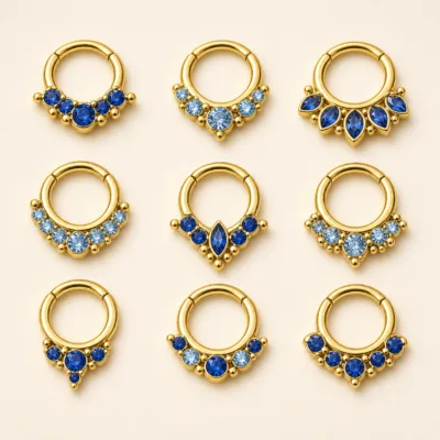 Piercing de Septo Dourado com Zircónias Azuis — Dourado com zircónias azuis