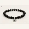 Pulseira de ónix preto com olho turco prateado