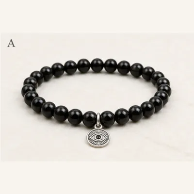Pulseira de ónix preto com olho turco prateado
