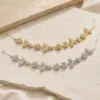 Acessório de cabelo para noiva com flores e folhas em dourado e prateado