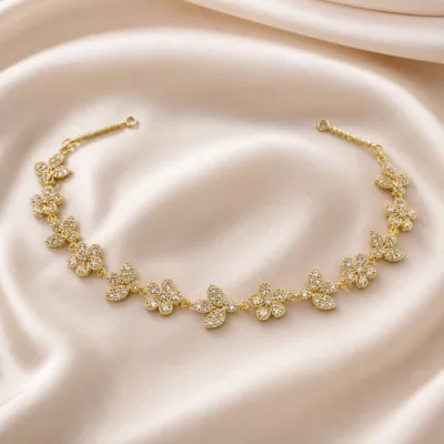 Acessório dourado de cabelo para noiva com flores e zircónias