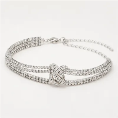 Pulseira prateada de zircónias com nó entrelaçado