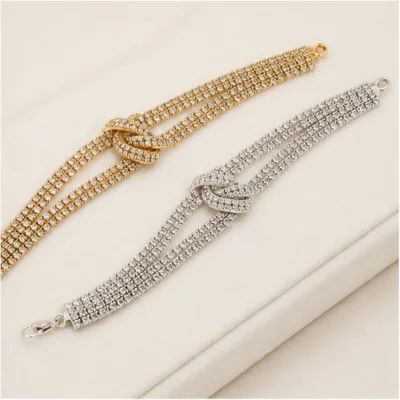 Pulseiras dourada e prateada com zircónias brancas