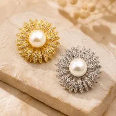 Alfinetes flor radiante dourado e prateado com pérolas brancas