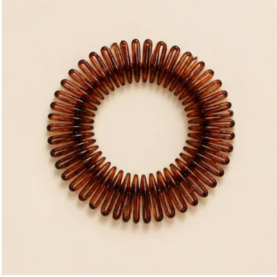 Travessa circular flexível castanha para cabelo