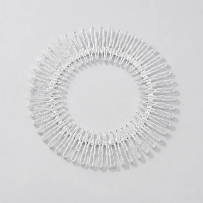 Travessa circular flexível prateada para cabelo