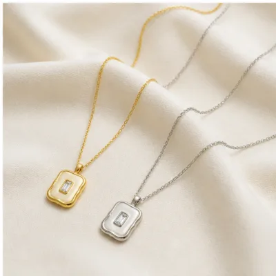 Square crystal necklaces on cream fabric 84397-02