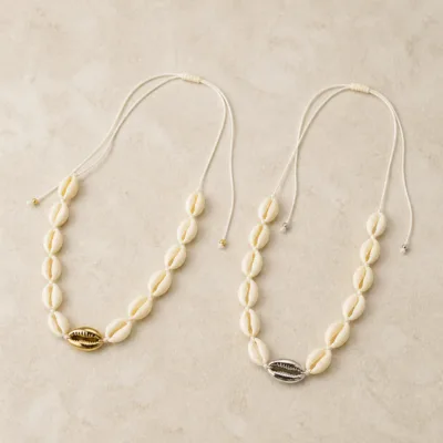 Ivory cowrie shell necklaces with gold and silver accents 84470-01