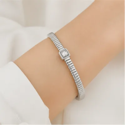 Silver-tone ribbed bangle 84822 worn on the wrist