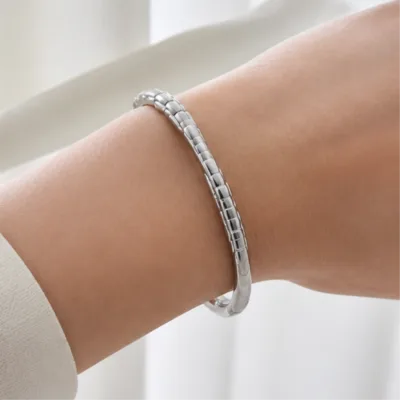 Silver-tone segmented bangle 84834 worn on wrist