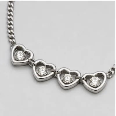 Close view of four linked crystal hearts on necklace 84838-02