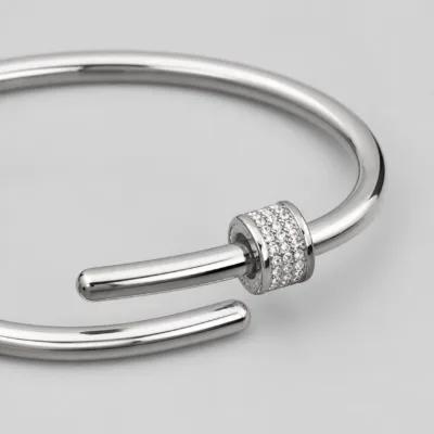 Close view of the crystal-set cylindrical detail on silver-tone cuff bracelet 84852