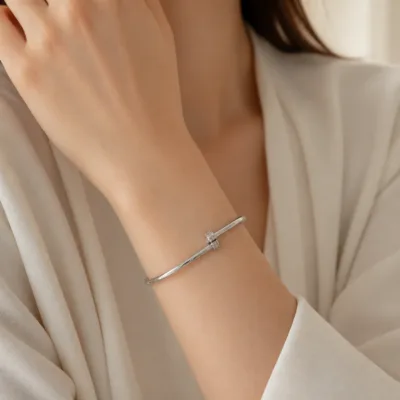 Silver-tone open cuff bracelet 84852 worn on the wrist